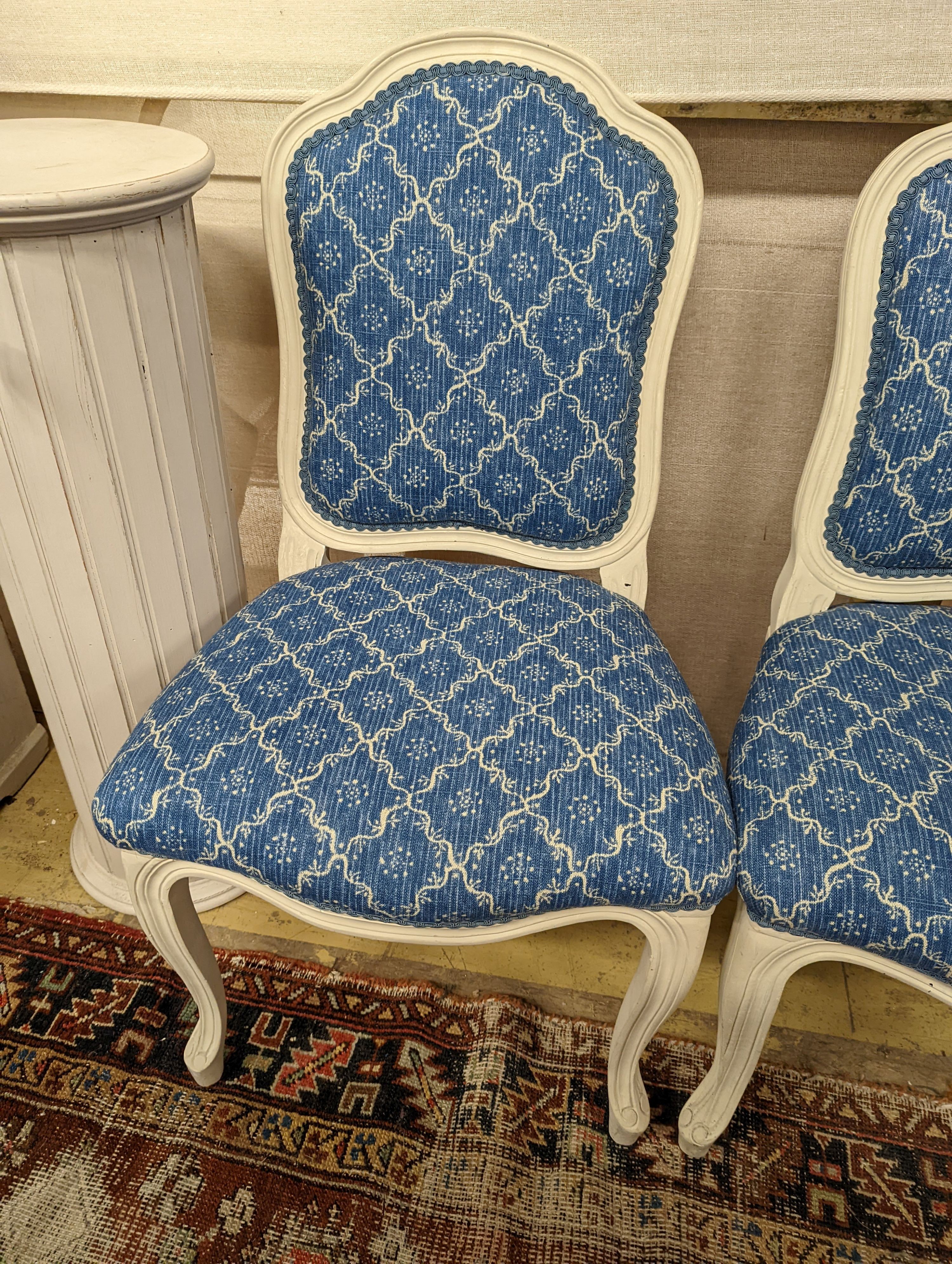 A pair of modern French painted upholstered side chairs